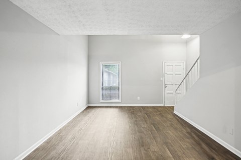 Open living room and dining room at Pine Village North in Smyrna, GA